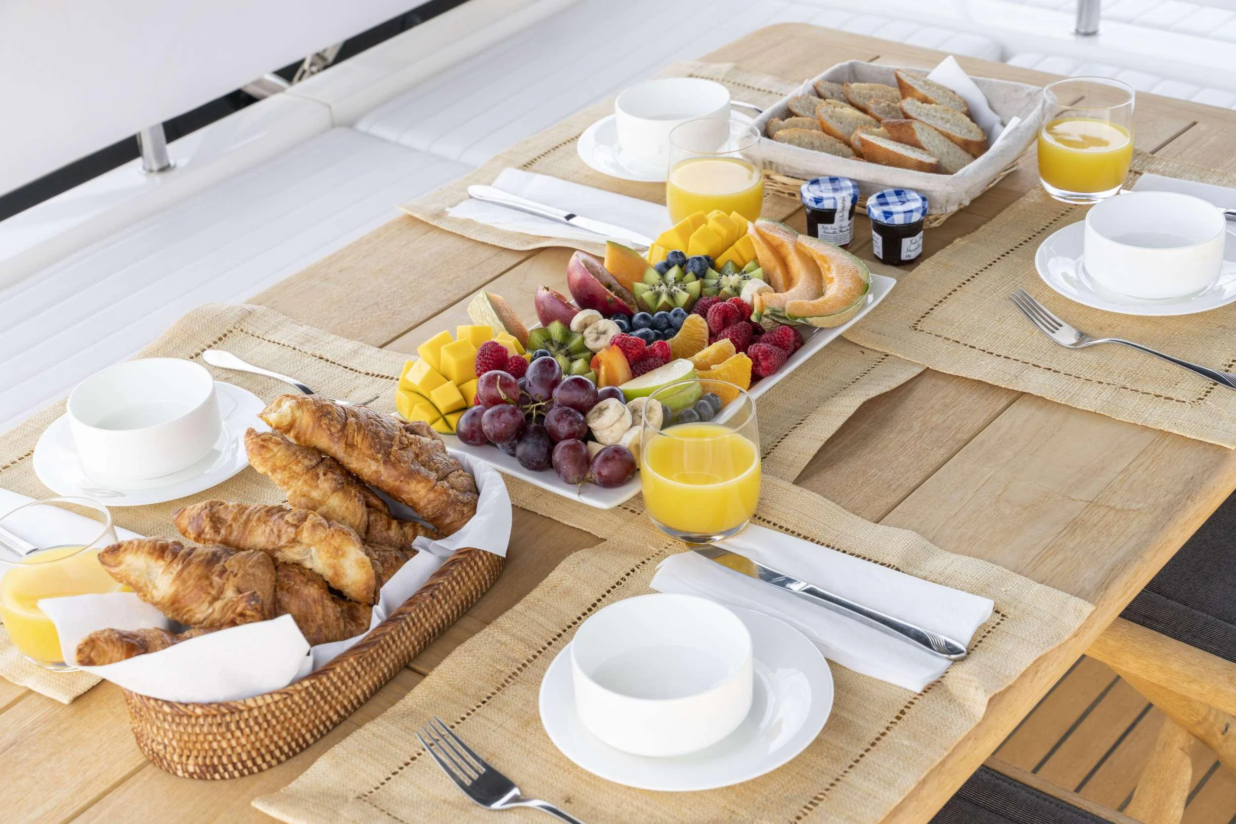 a table with food and drinks aboard LAZY P Yacht for Charter