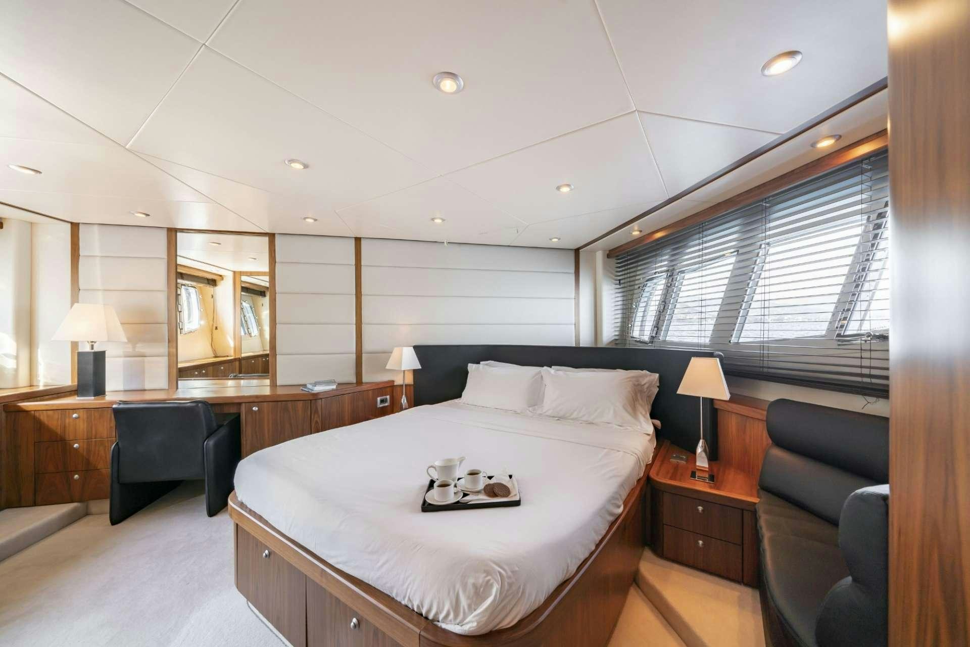 a bedroom with a large bed aboard LAZY P Yacht for Charter