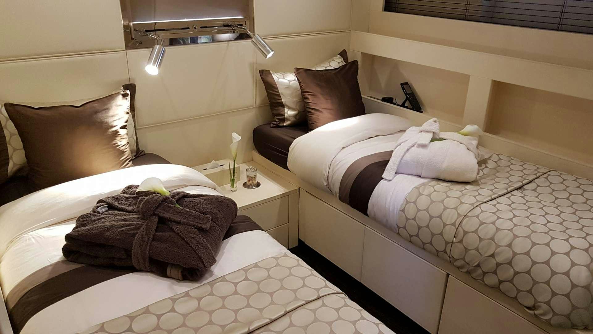 a couple of beds in a hotel room aboard TEMPEST WS Yacht for Charter