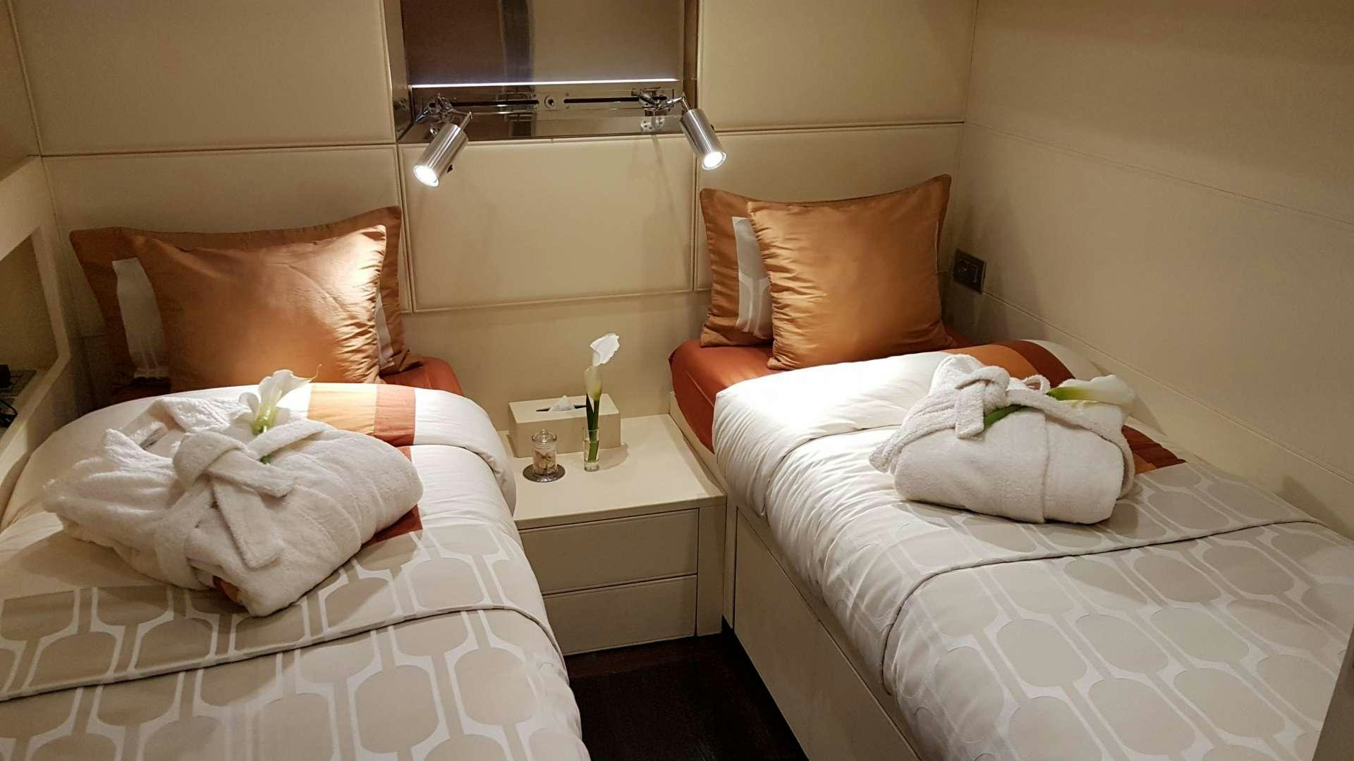 a couple of beds in a hotel room aboard TEMPEST WS Yacht for Charter
