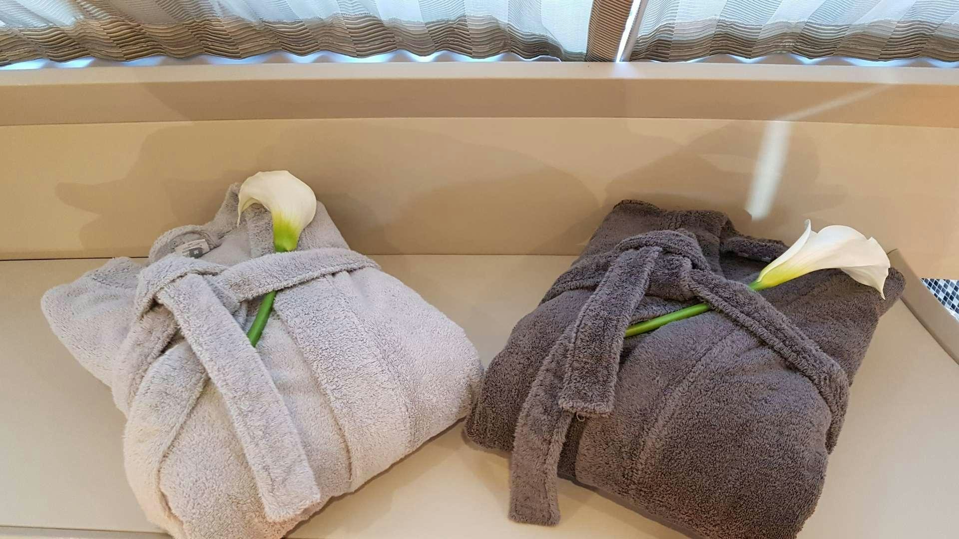 a pair of towels on a shelf aboard TEMPEST WS Yacht for Charter