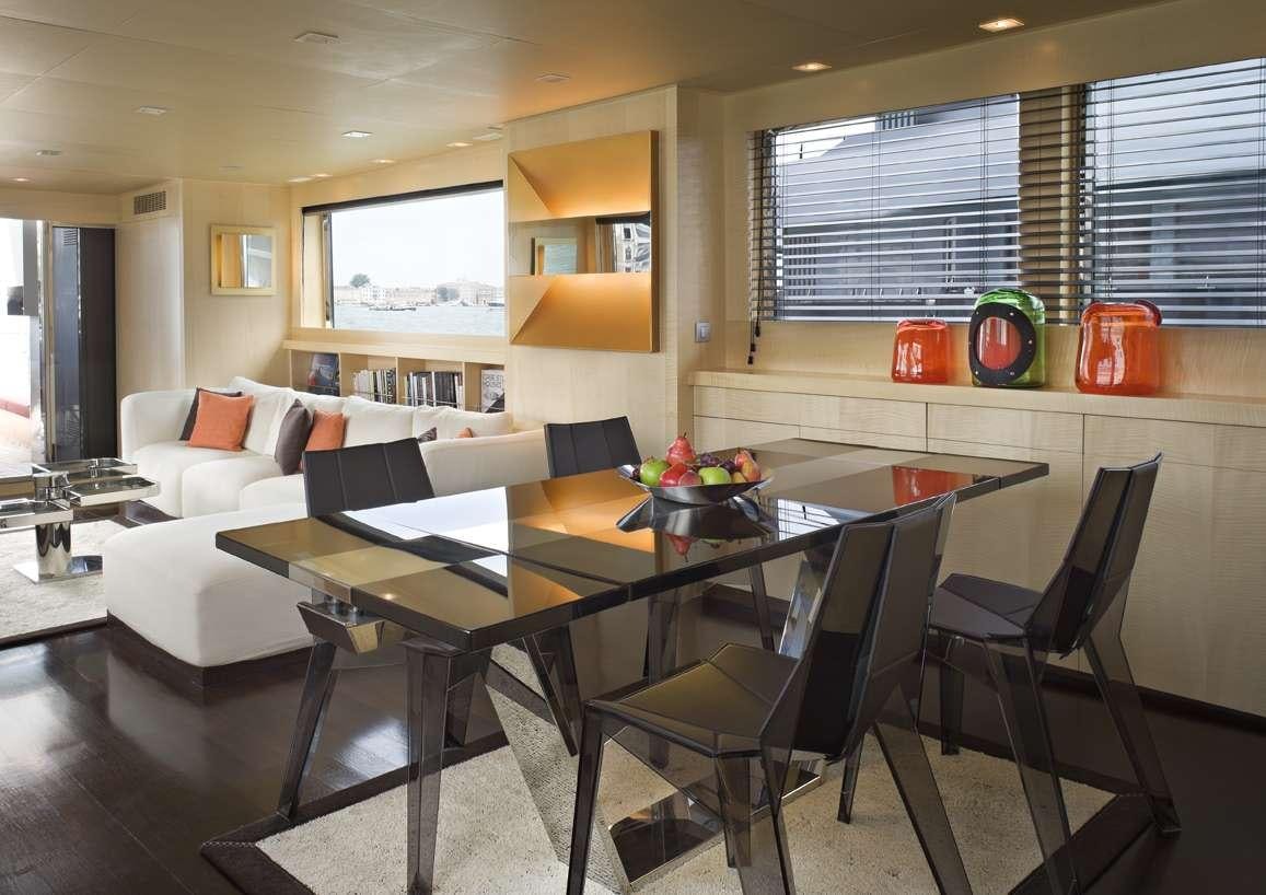 a living room with a table and chairs aboard TEMPEST WS Yacht for Charter