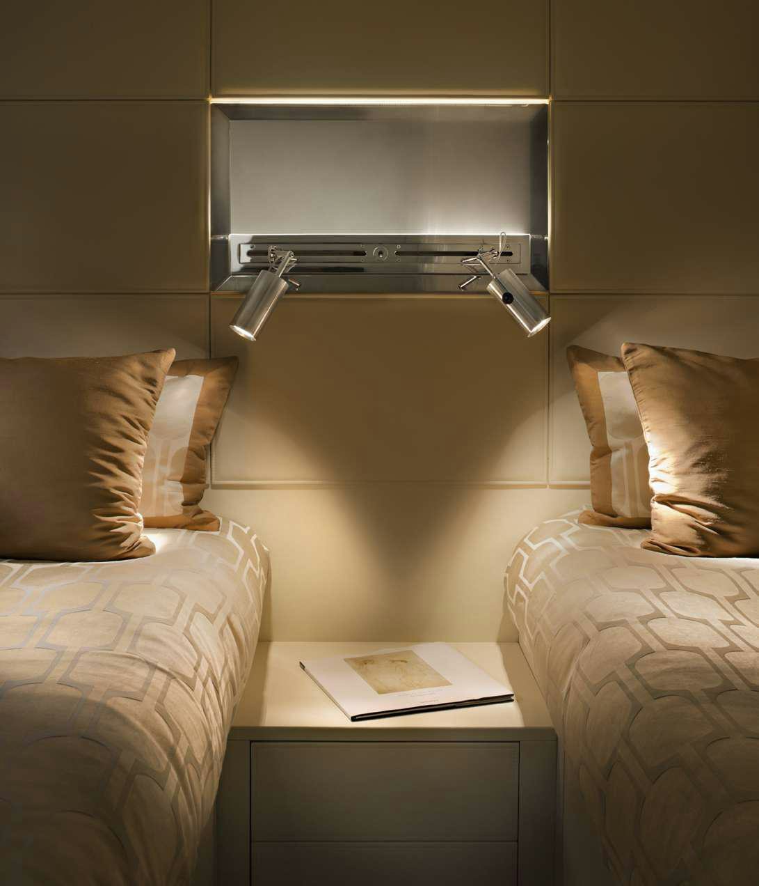 a bed with a shelf above it aboard TEMPEST WS Yacht for Charter