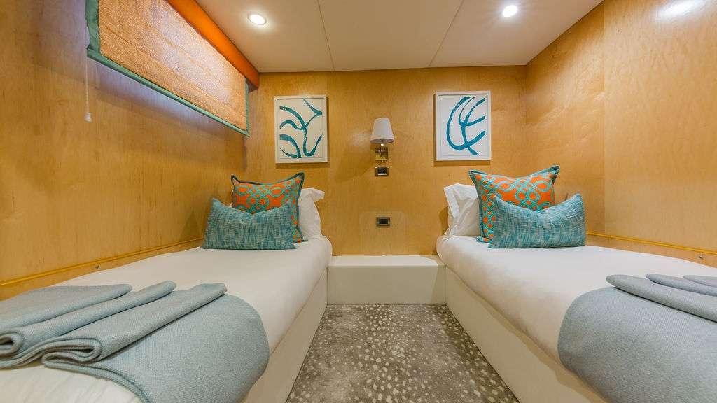 a room with couches and a bed aboard ALEXANDRA JANE Yacht for Charter