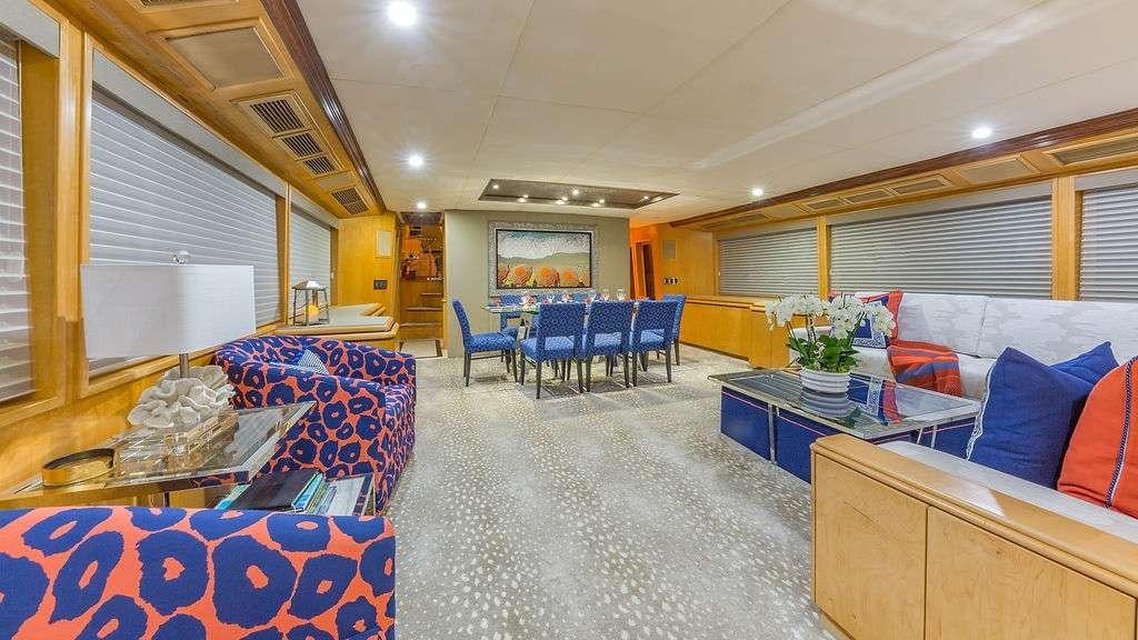 a large room with a couch and a table aboard ALEXANDRA JANE Yacht for Charter