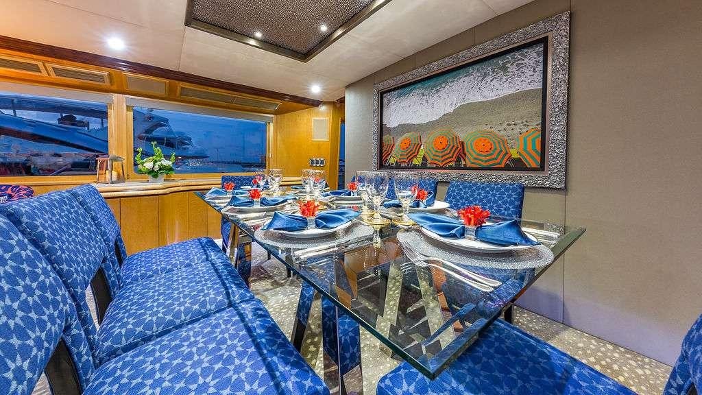 a dining room with a table and chairs aboard ALEXANDRA JANE Yacht for Charter