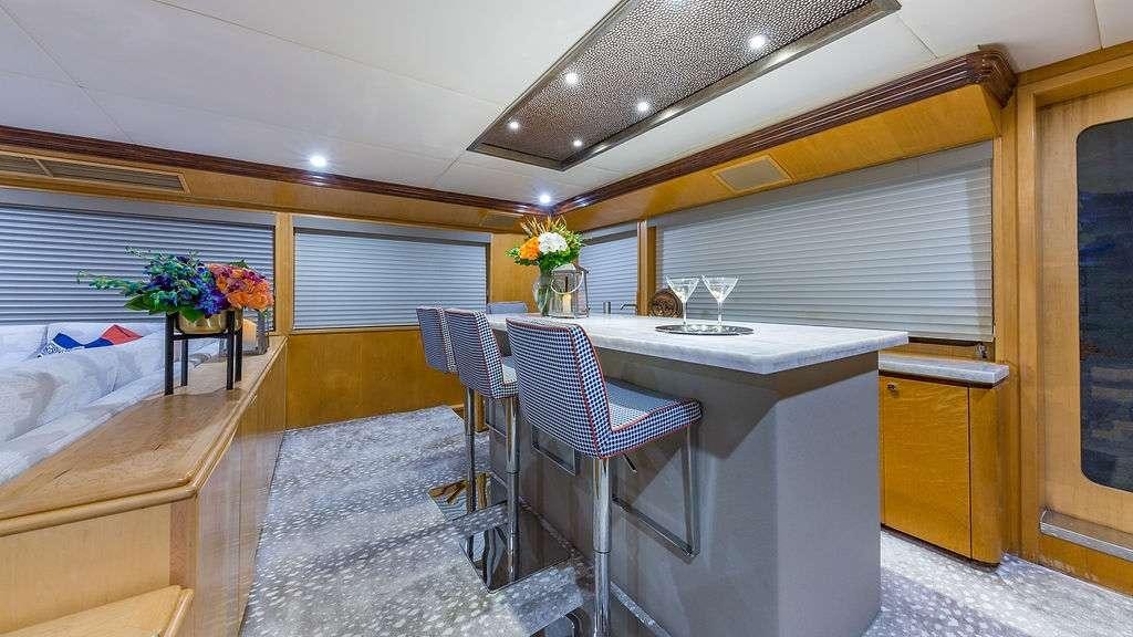 a room with a table and chairs aboard ALEXANDRA JANE Yacht for Charter