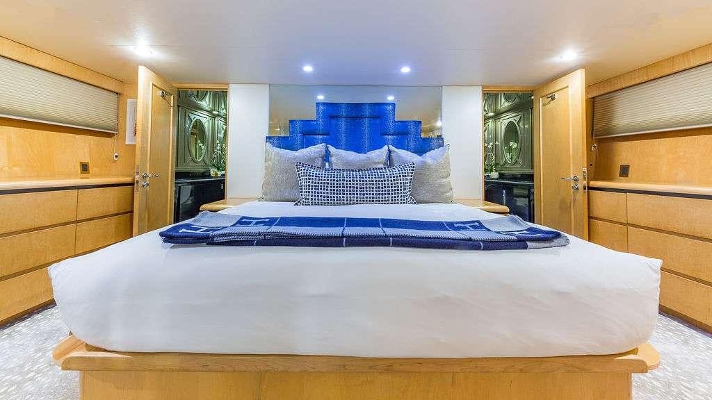 a large bed in a room aboard ALEXANDRA JANE Yacht for Charter
