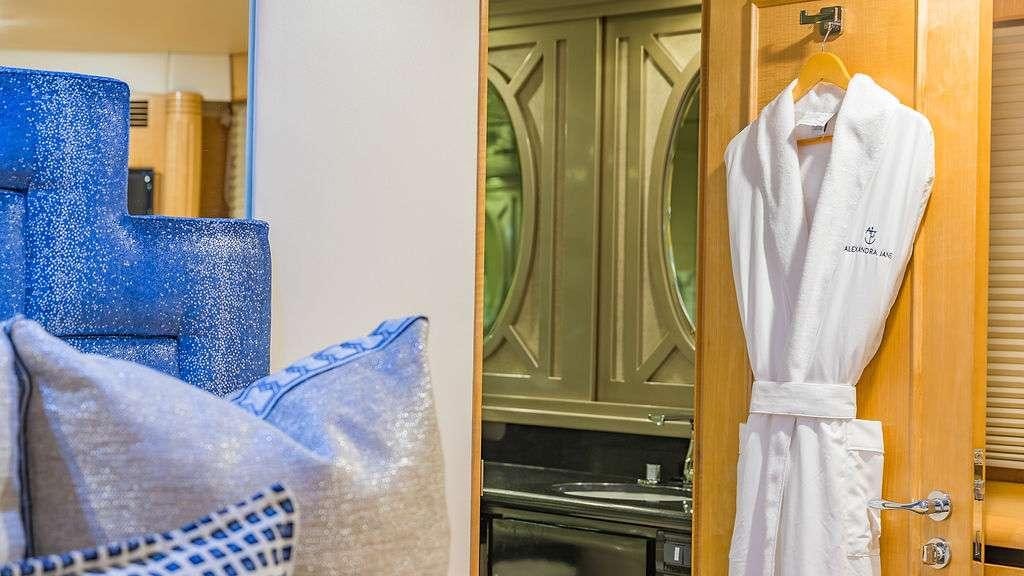 a room with a chair and a closet aboard ALEXANDRA JANE Yacht for Charter