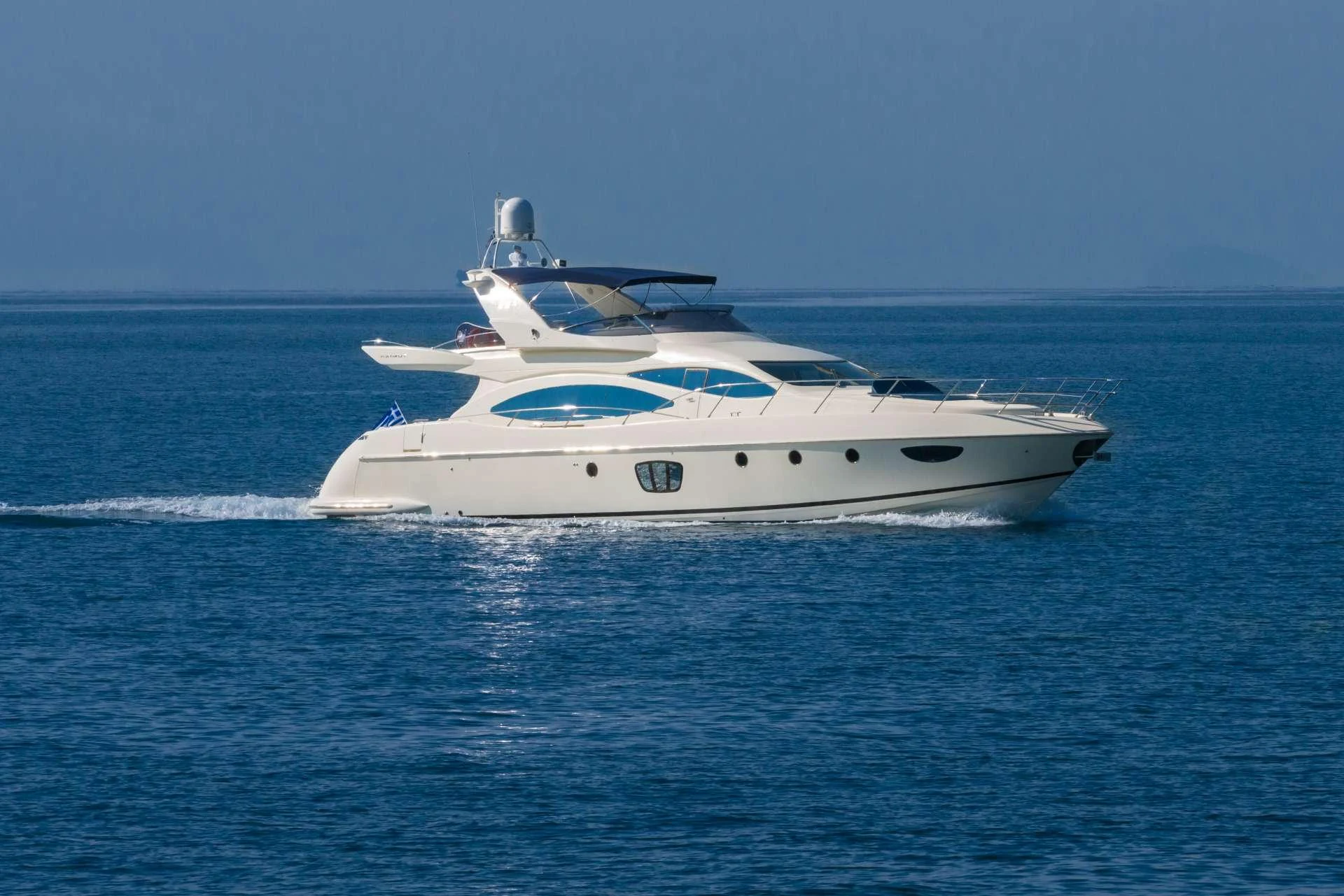a white yacht in the water aboard ALMAZ Yacht for Charter