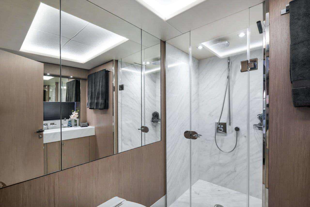 a bathroom with a shower unit aboard GOLDEN OURS Yacht for Charter