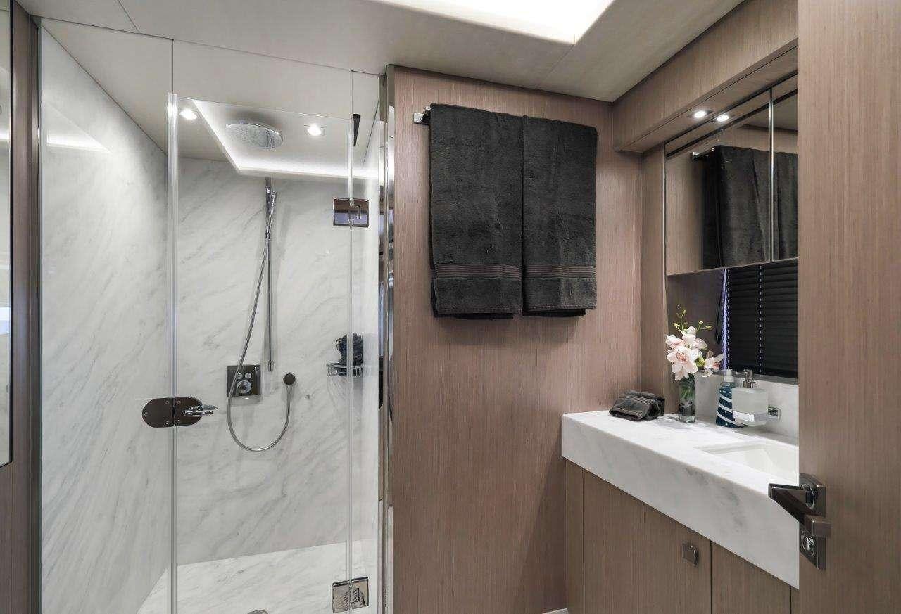 a shower unit in a bathroom aboard GOLDEN OURS Yacht for Charter