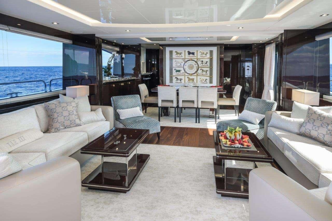 a living room with a large window aboard GOLDEN OURS Yacht for Charter