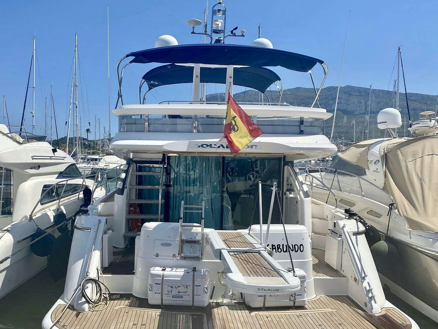 a boat docked at a pier aboard VAGABUNDO Yacht for Charter