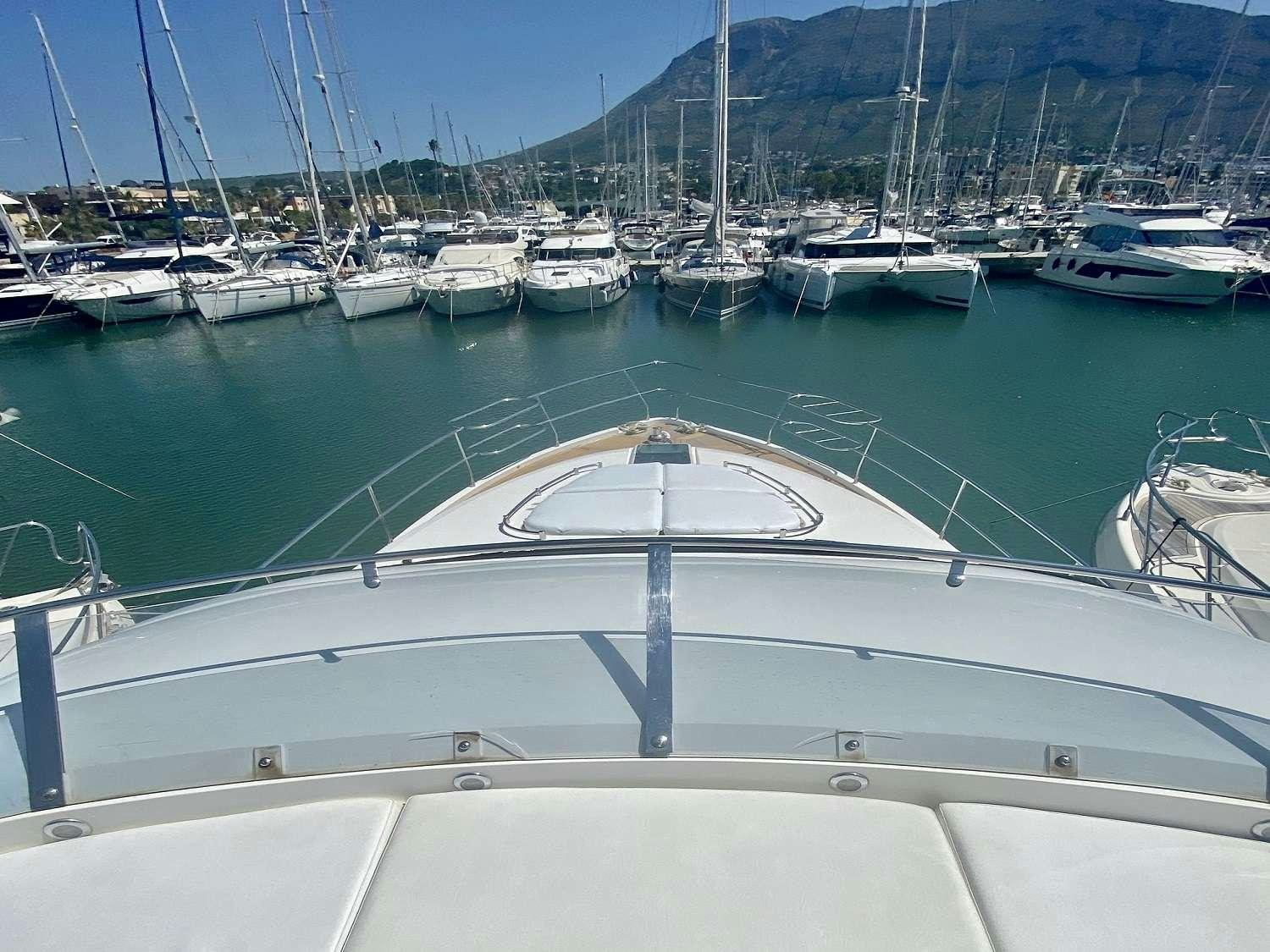 a boat in a harbor aboard VAGABUNDO Yacht for Charter