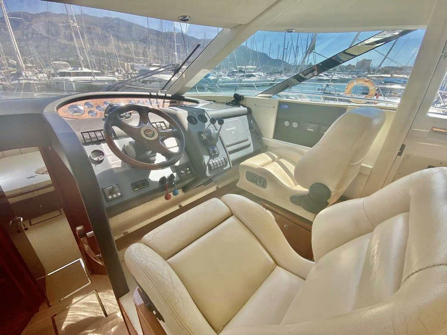 inside of a car aboard VAGABUNDO Yacht for Charter