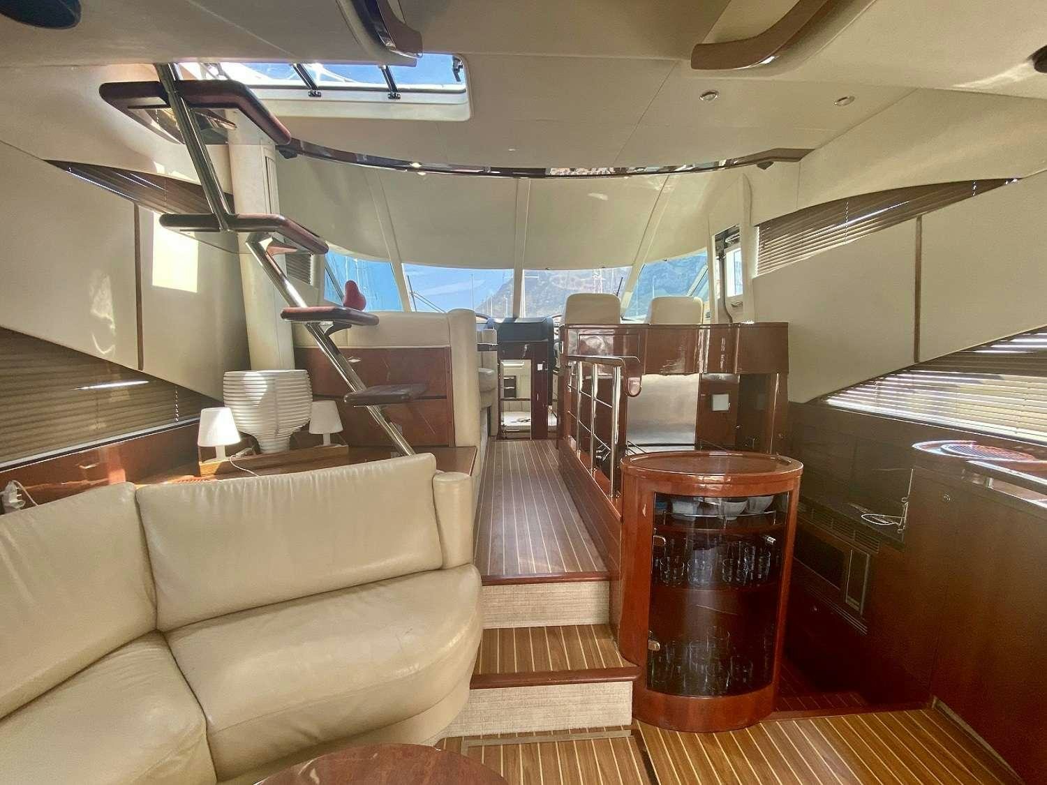 a room with a couch and a table aboard VAGABUNDO Yacht for Charter