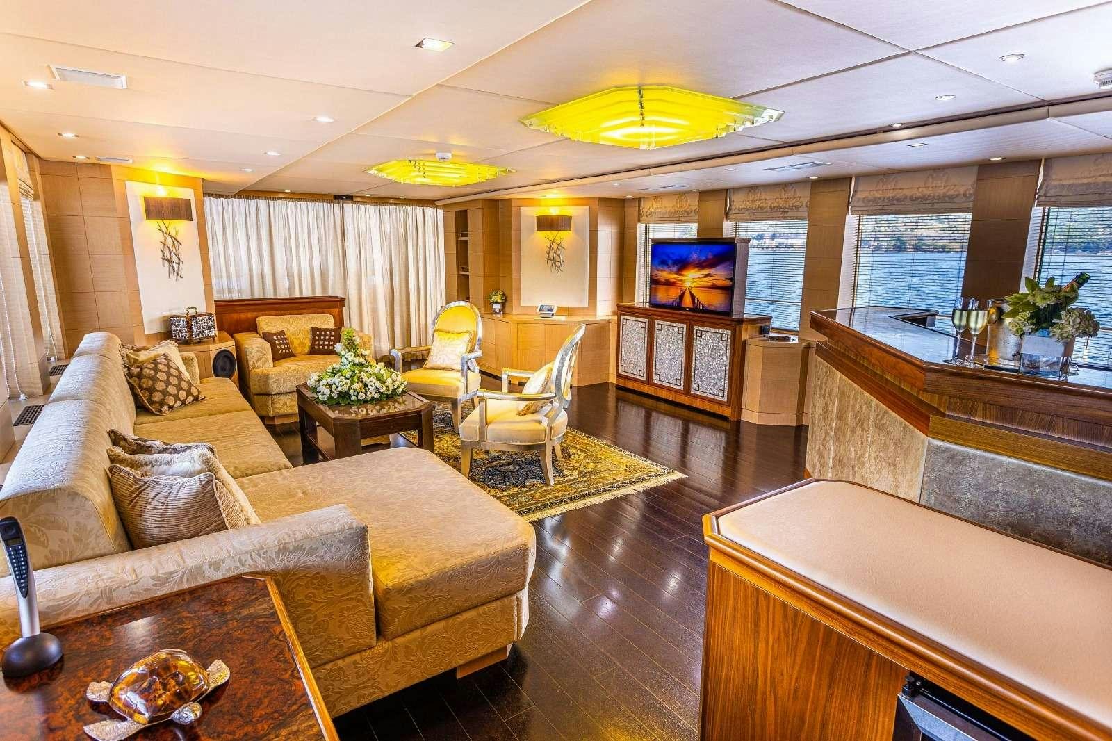 a living room with a large window aboard MILAYA Yacht for Charter