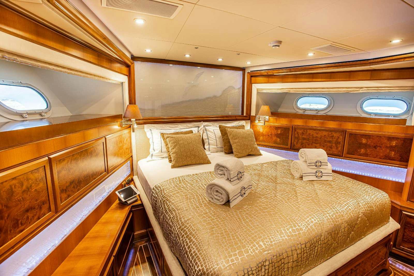 a large bed in a room aboard MILAYA Yacht for Charter