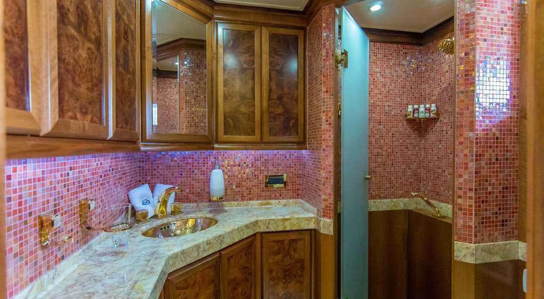 a bathroom with a sink and cabinets aboard MILAYA Yacht for Charter