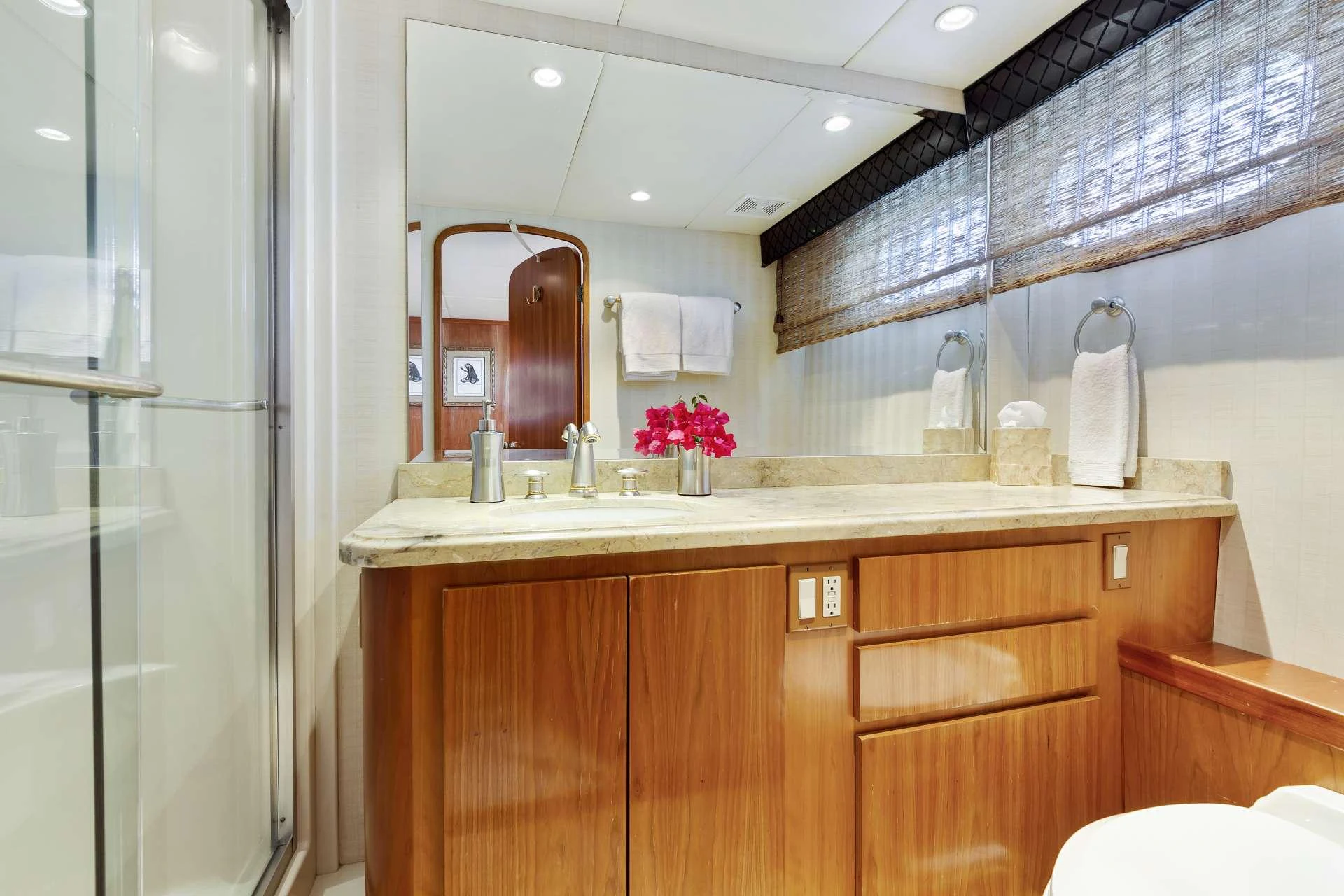 a bathroom with a sink and a mirror aboard IL CAPO Yacht for Charter