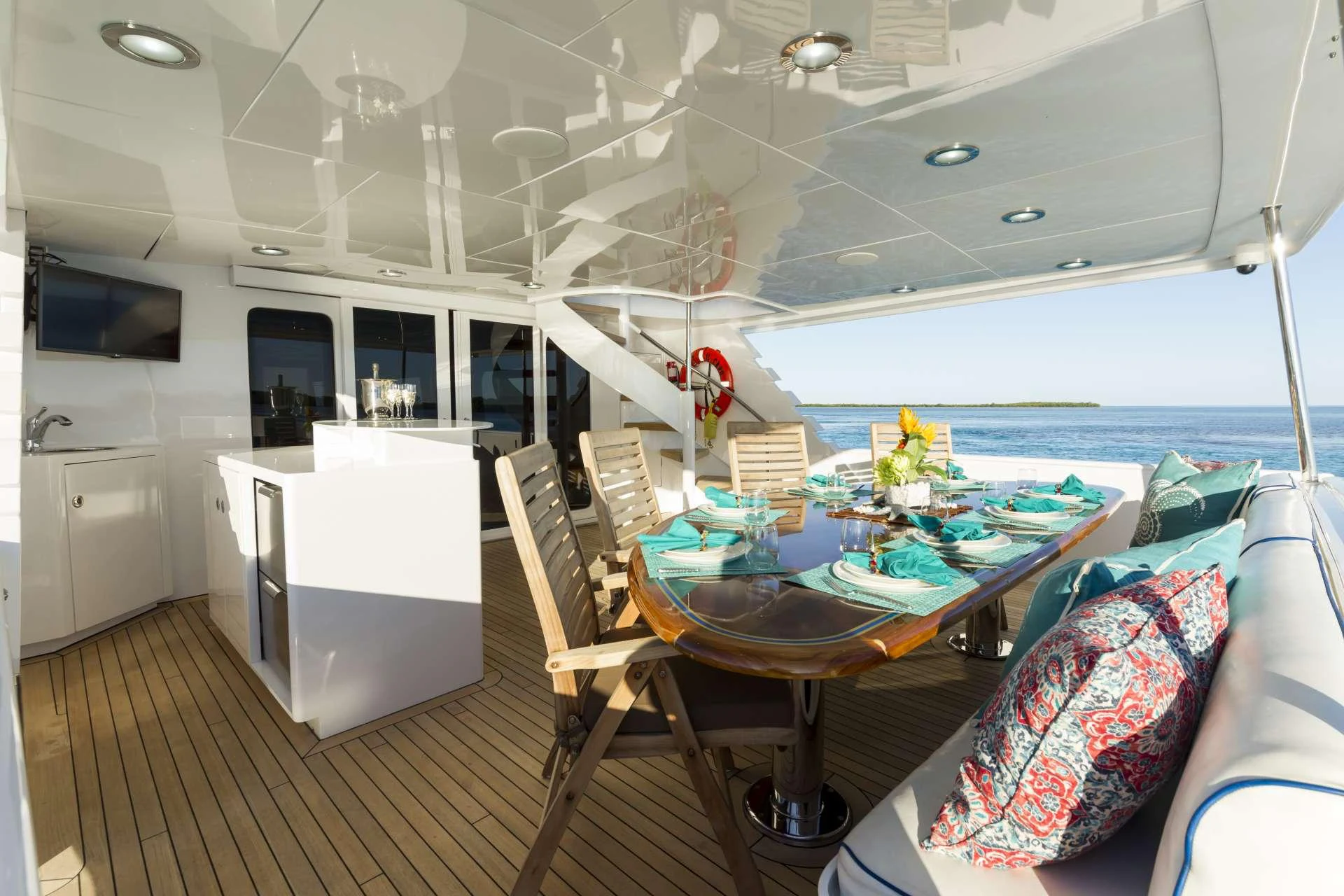 a room with a table and chairs aboard IL CAPO Yacht for Charter