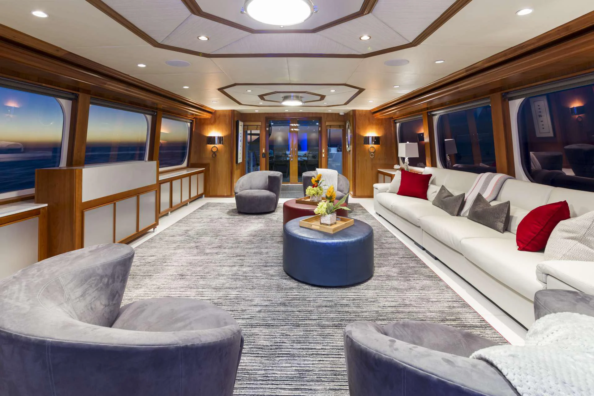 a large living room with white couches and a table aboard IL CAPO Yacht for Charter