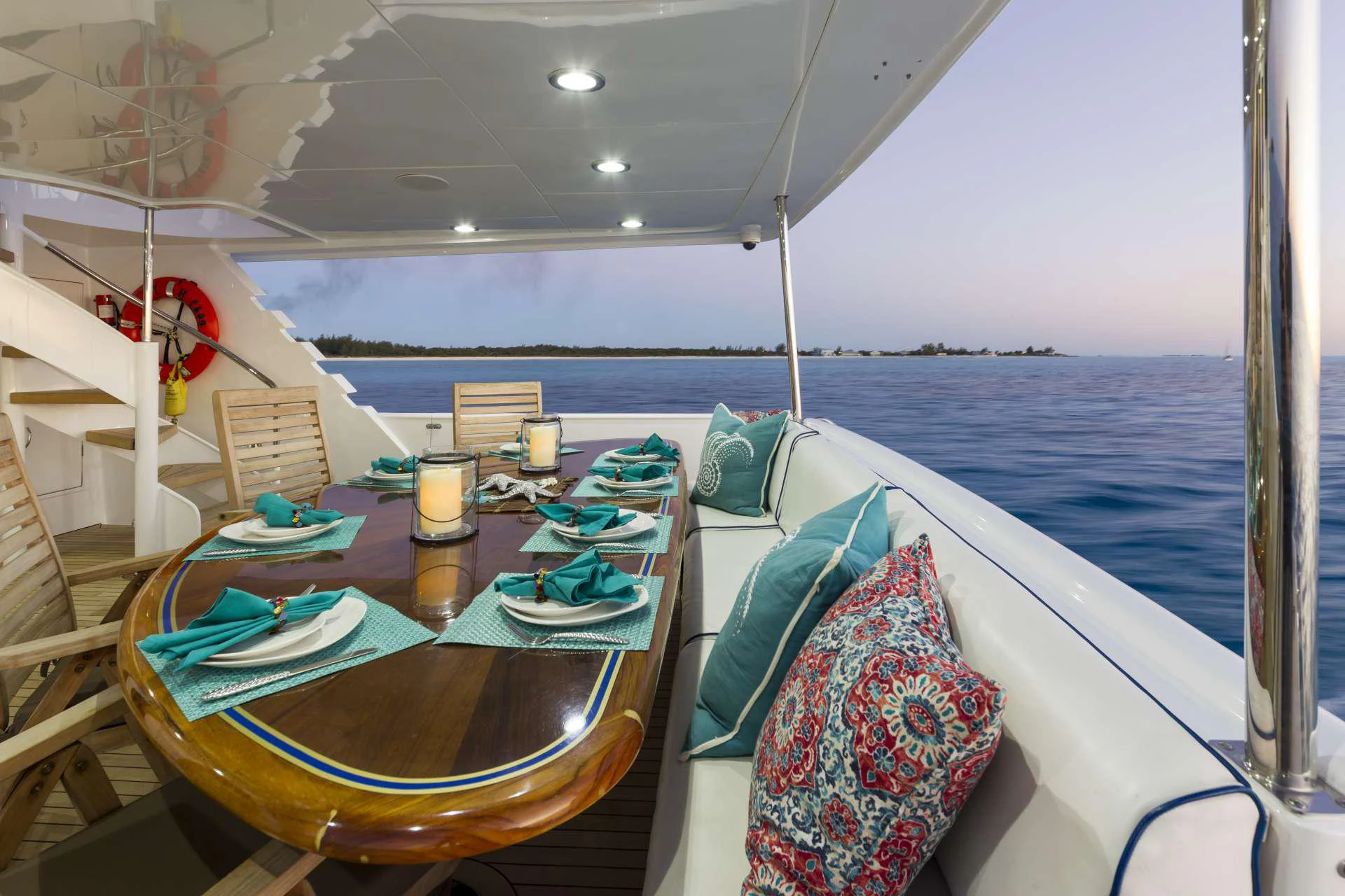 a table with plates and food on it aboard IL CAPO Yacht for Charter