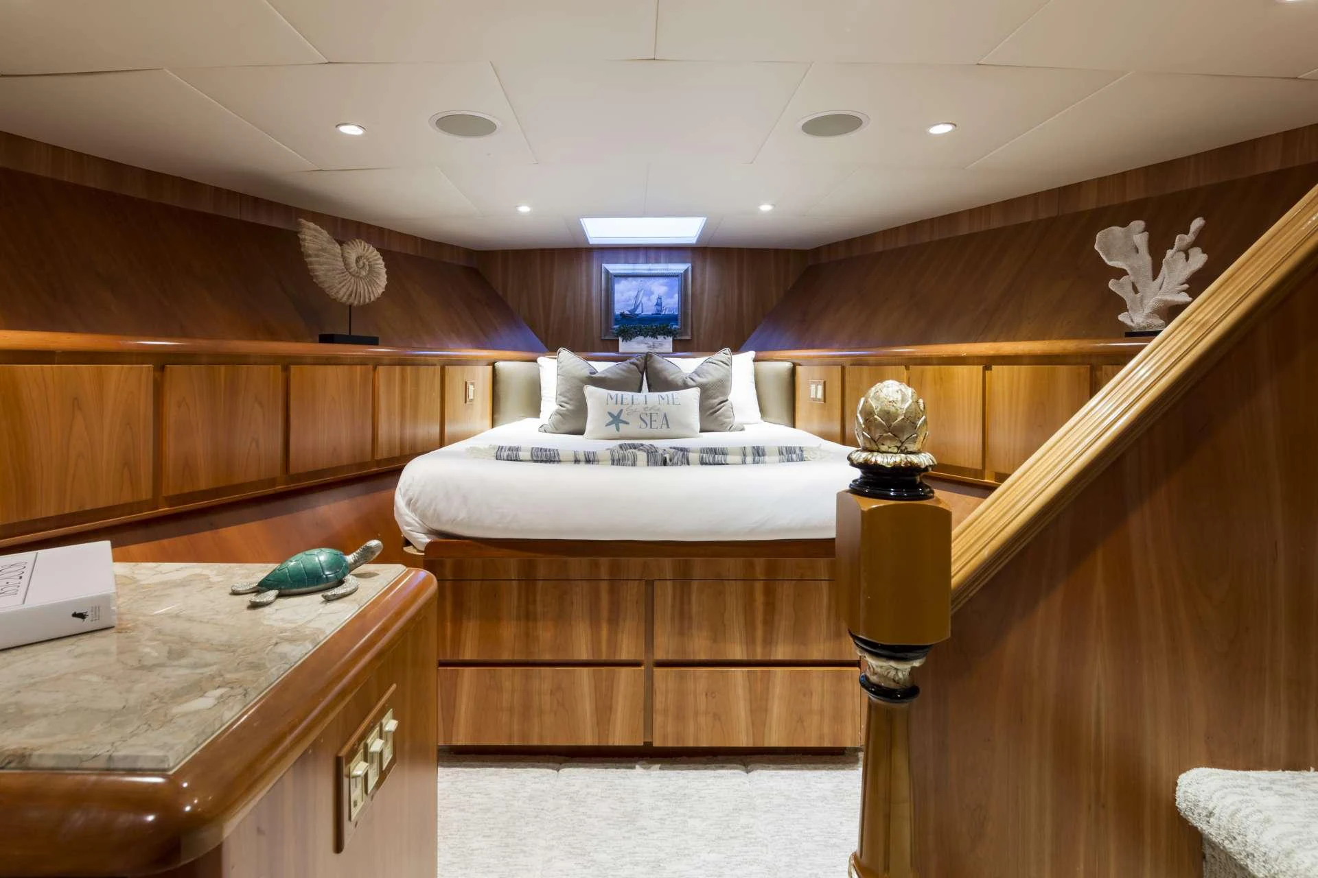 a room with wooden walls and a couple of beds aboard IL CAPO Yacht for Charter