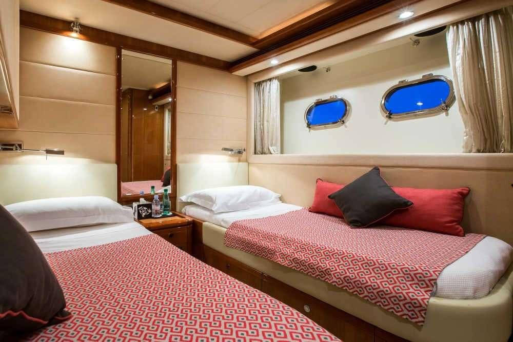 a room with two beds aboard PIOLA Yacht for Charter