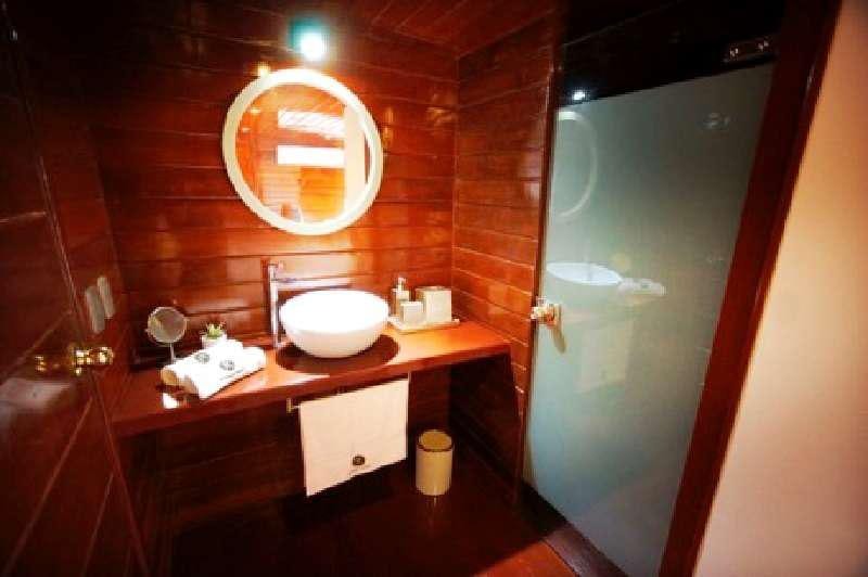 a bathroom with a sink and a mirror aboard CRUCERO AMAZONAS Yacht for Charter