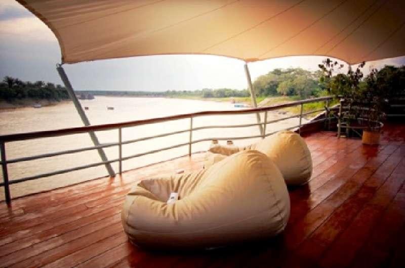 a large pillow on a porch aboard CRUCERO AMAZONAS Yacht for Charter