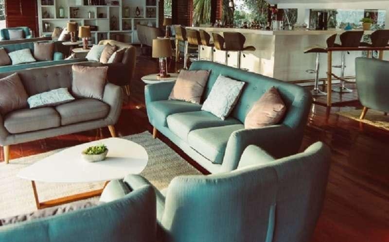 a living room with a couch and a table aboard CRUCERO AMAZONAS Yacht for Charter