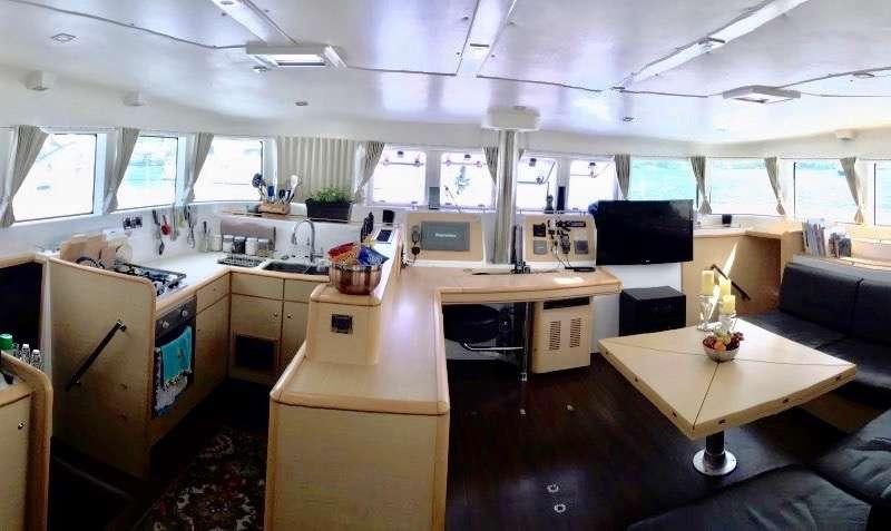 a large kitchen with a large window aboard CATATONIC 500 Yacht for Charter