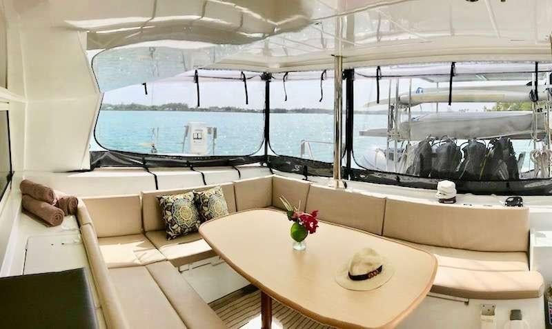 a room with a table and a couch aboard CATATONIC 500 Yacht for Charter