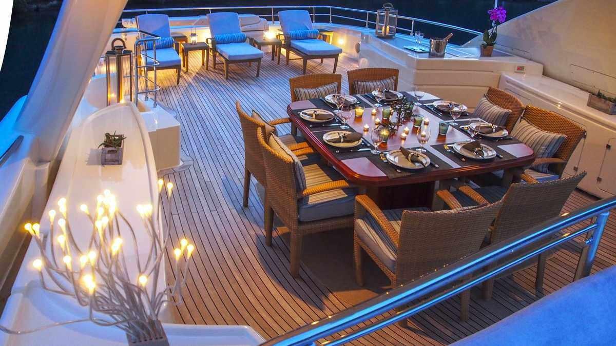 a dining room with a table and chairs aboard ARIELA Yacht for Charter