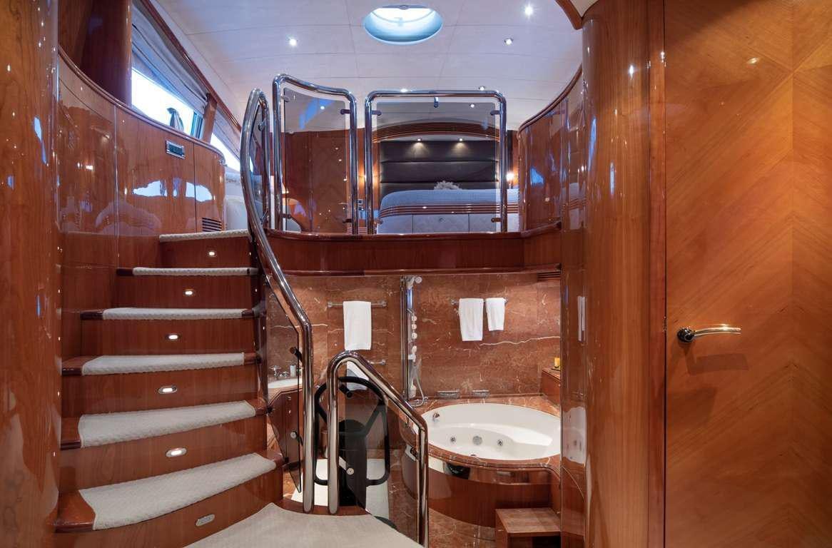 a bathroom with a wood cabinet aboard MI ALMA Yacht for Charter