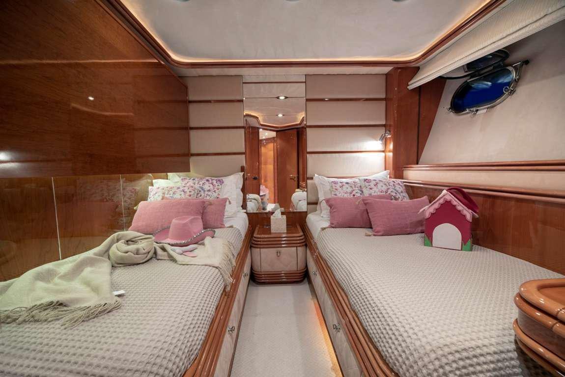 a room with two beds aboard MI ALMA Yacht for Charter
