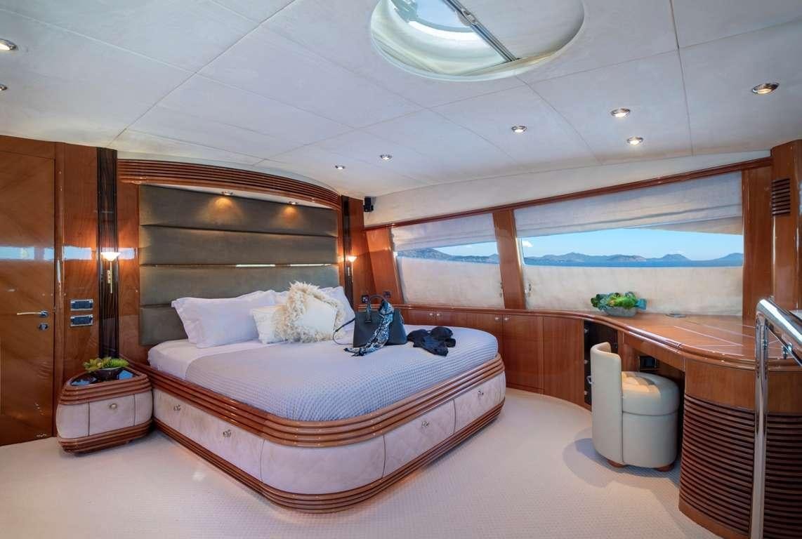a large bed in a room aboard MI ALMA Yacht for Charter