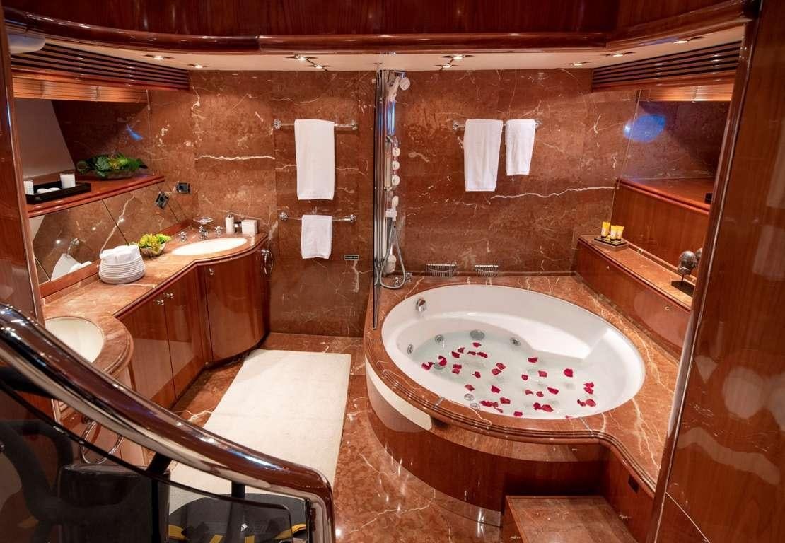a bathroom with a sink and a bathtub aboard MI ALMA Yacht for Charter