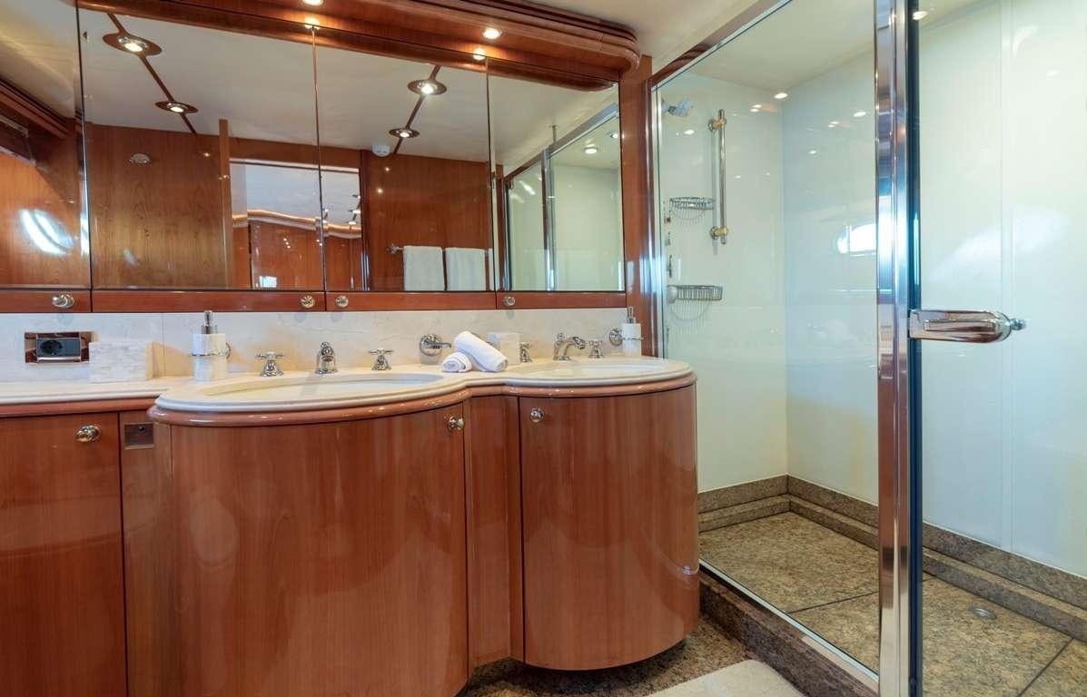 a bathroom with a sink and a shower aboard MI ALMA Yacht for Charter