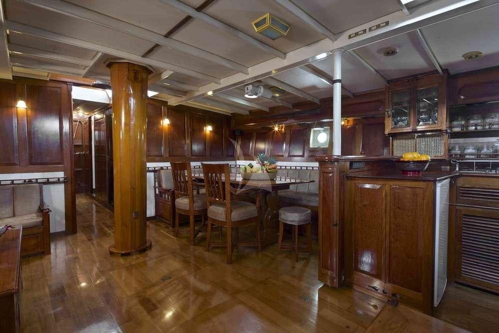 a large kitchen with a bar and bar aboard Sunshine Yacht for Charter