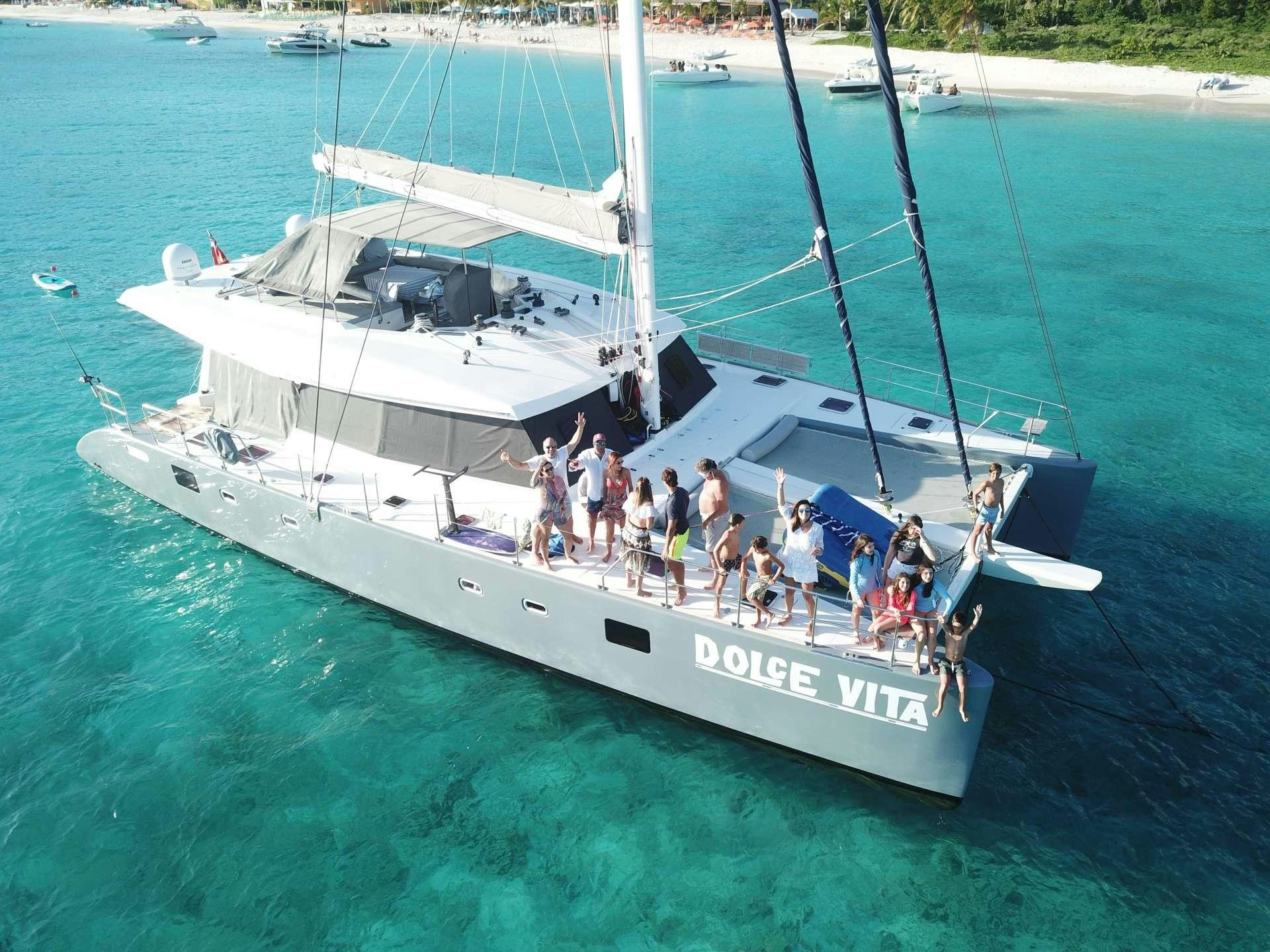 a group of people on a boat aboard DOLCEVITACAT Yacht for Charter