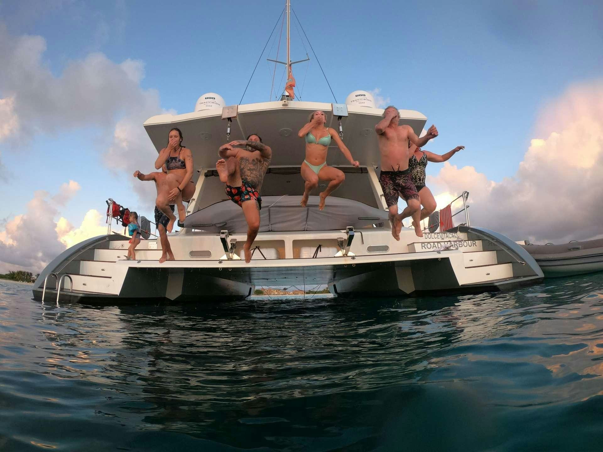 a group of people on a boat aboard DOLCEVITACAT Yacht for Charter