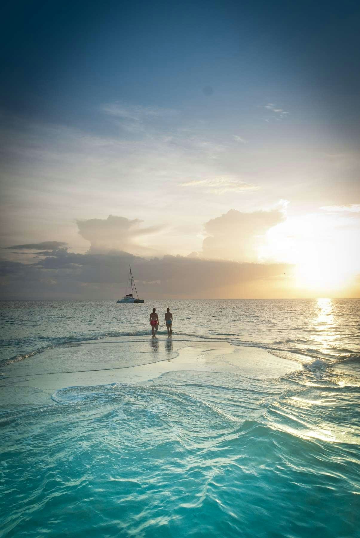 a person walking in the water aboard Flojo Yacht for Charter