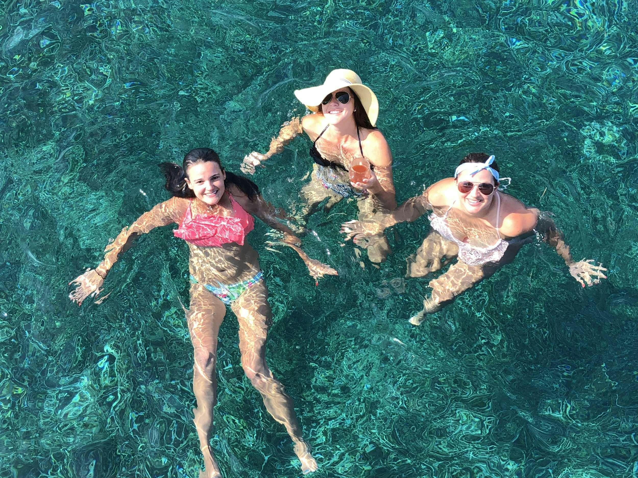 a group of women in the grass aboard Flojo Yacht for Charter