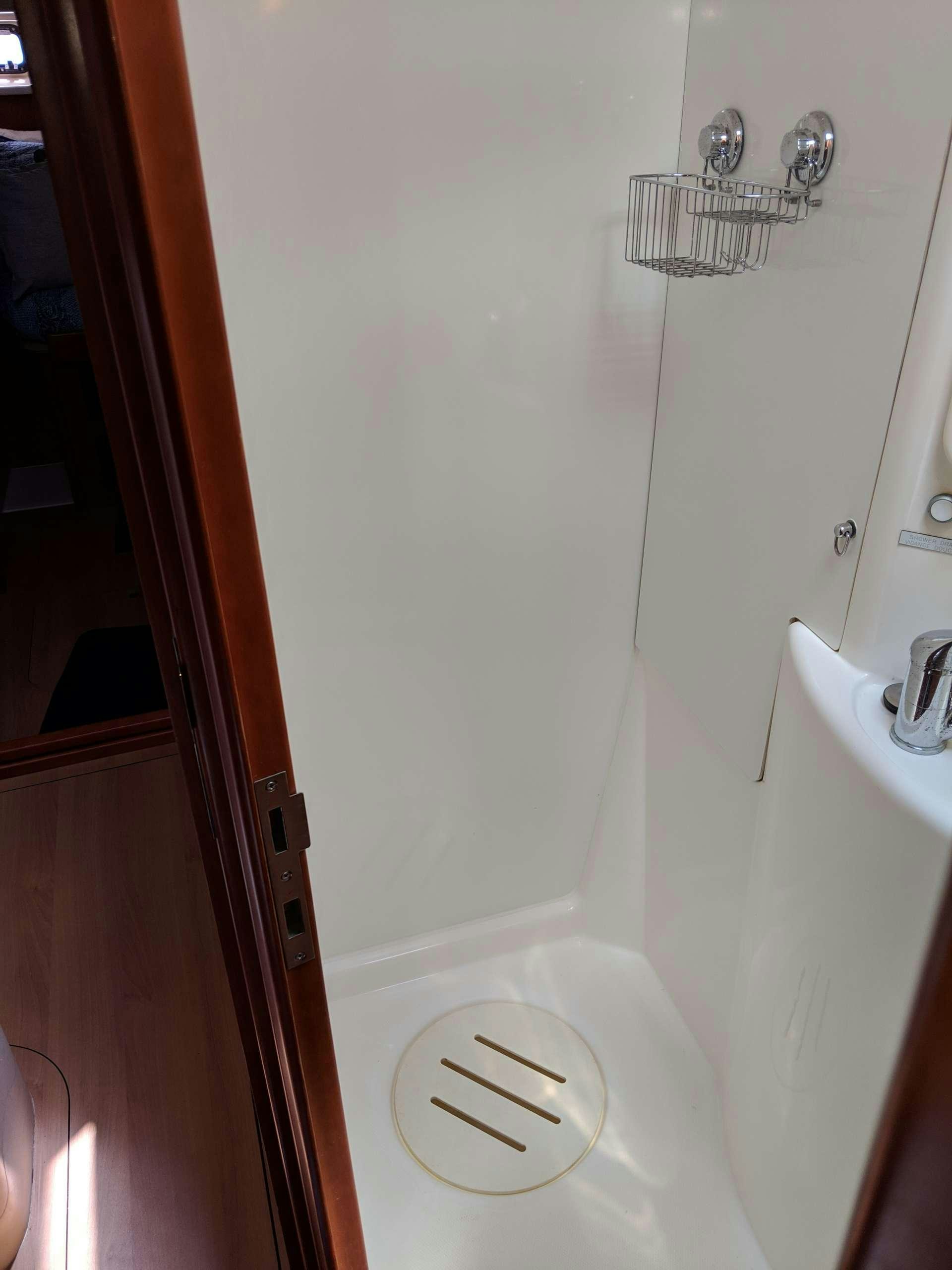 a door with a urinal aboard Flojo Yacht for Charter