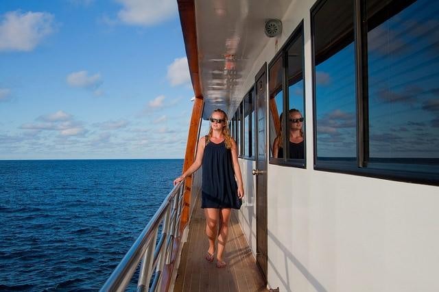 a man standing on a boat aboard GALAPAGOS SEA STAR JOURNEY Yacht for Charter