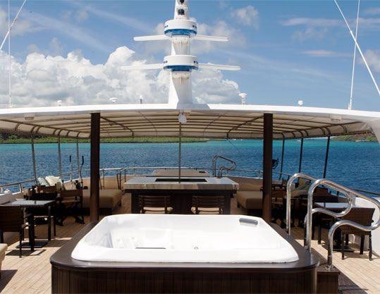 a table on a boat aboard GALAPAGOS SEA STAR JOURNEY Yacht for Charter