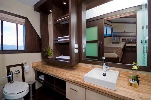 a bathroom with a sink and a mirror aboard GALAPAGOS SEA STAR JOURNEY Yacht for Charter